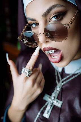 A supermodel portrayed as a captivating female nun